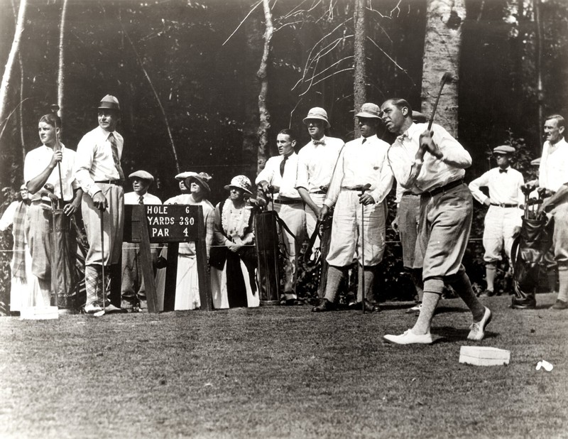 Golf legend Walter Hagen driving off the tee on the Saranac Inn course in 1923